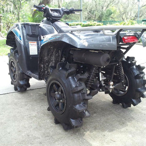 Interco Interforce II off-road mud and snow tires in 27x6-12 size, mounted and installed on a Kawasaki Brute Force quad, parked on a driveway.