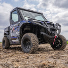 The ITP Kawasaki Mule outfitted with the brand new Cross Trax heavy duty utility all-terrain tires, parked in a stubble corn field.