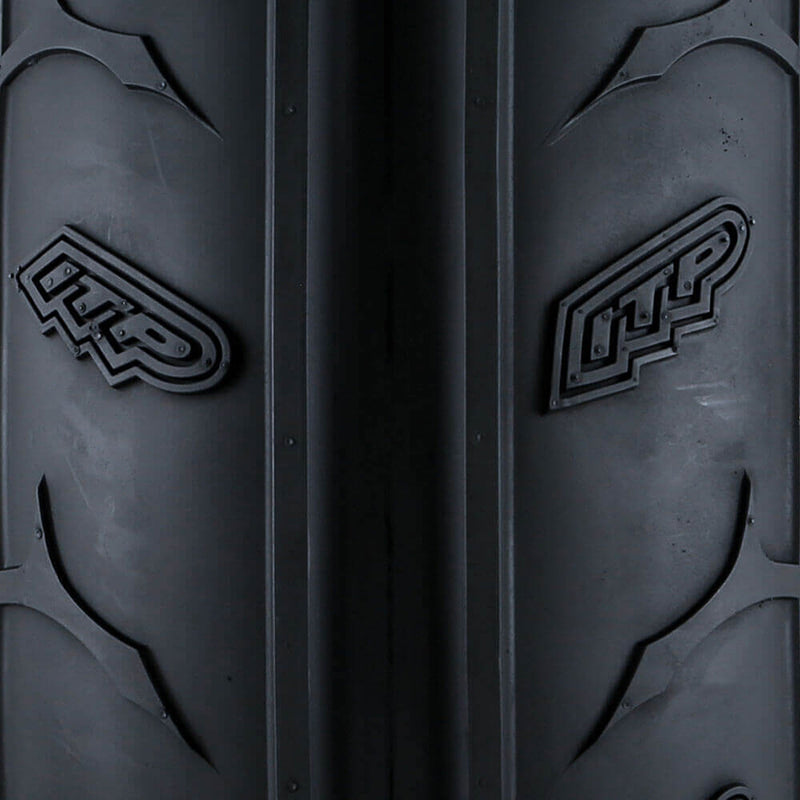 Close up view of the tread detail and ITP molded into the front dual rib Sand Star ATV and SXS tire.