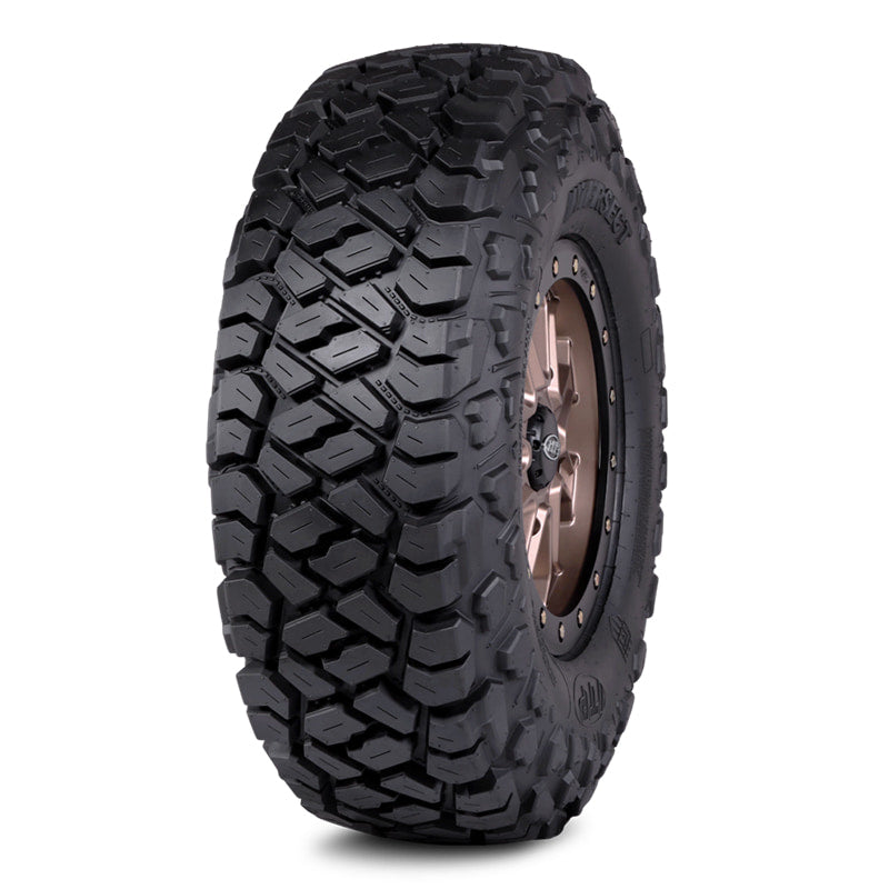Angled view of ITP Intersect 8-ply Radial UTV and Side-by-side high performance tire with all terrain tread pattern.