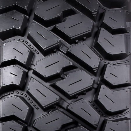 Detailed close-up view of the tread design and lug block details of the Intersect UTV tire by ITP Tire.