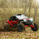 Can-Am Maverick R mounted with Savage XT tires and wheels, drifting through a cornfield in Tennessee.