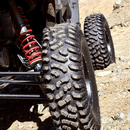 Detailed view of Terra Hook radial tire installed on sxs in hard pack terrain.