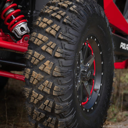 Close up of Versa Cross V3 all terrain tire by ITP installed and mounted on Polaris RZR side-by-side.