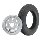 4.80-12 Loadstar tire mounted on 12x4ja white steel spoke trailer wheel in 5 on 4.5 bolt pattern.