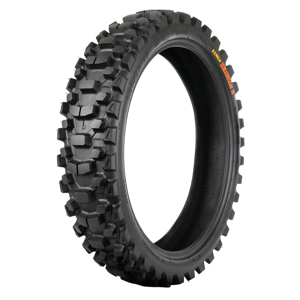 Angled image of the Kenda K785 Millville 2 rear dirt bike tire, engineered for top MX and Off-road performance, with a high traction scoop style center lug pattern for soft to intermediate conditions with tie bar knob to reduce squirm and increase stability, sold with fast and free shipping.