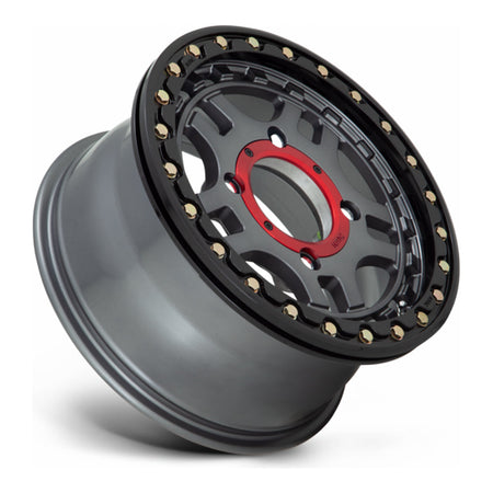 KMC Recon Beadlock KS240 UTV wheel in gunmetal with gloss black ring, side angle showing the barrel and lip
