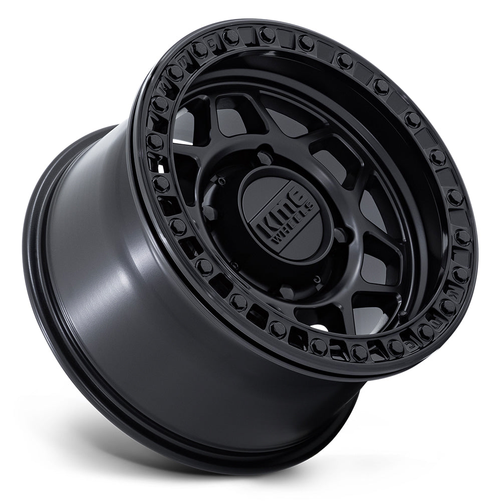 Angled view of the KMC Wheels UTV / Side-by-side beadlock 15x8 matte black finish wheel, featuring a 6-element mesh design and zinc treated beadlock hardware, available in 4-lug, 5-lug, and 6-lug bolt patterns.