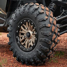 Maxxis Carnage 29x9R14 front tire mounted on high performance side-by-side.