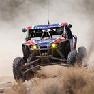 Side-by-side racing competitor ripping through the desert on his Maxxis RAZR XT competition SBR tires.
