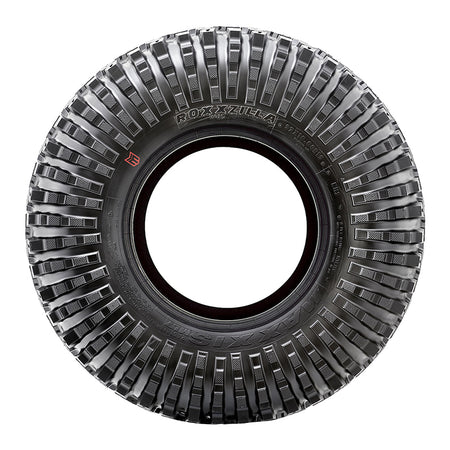 Sidewall view of a mounted Roxxzilla radial rock and desert tire showing the reinforced sidewall lug design and color branded Maxxis logo, available in 14", 15", and 17" wheel sizes.