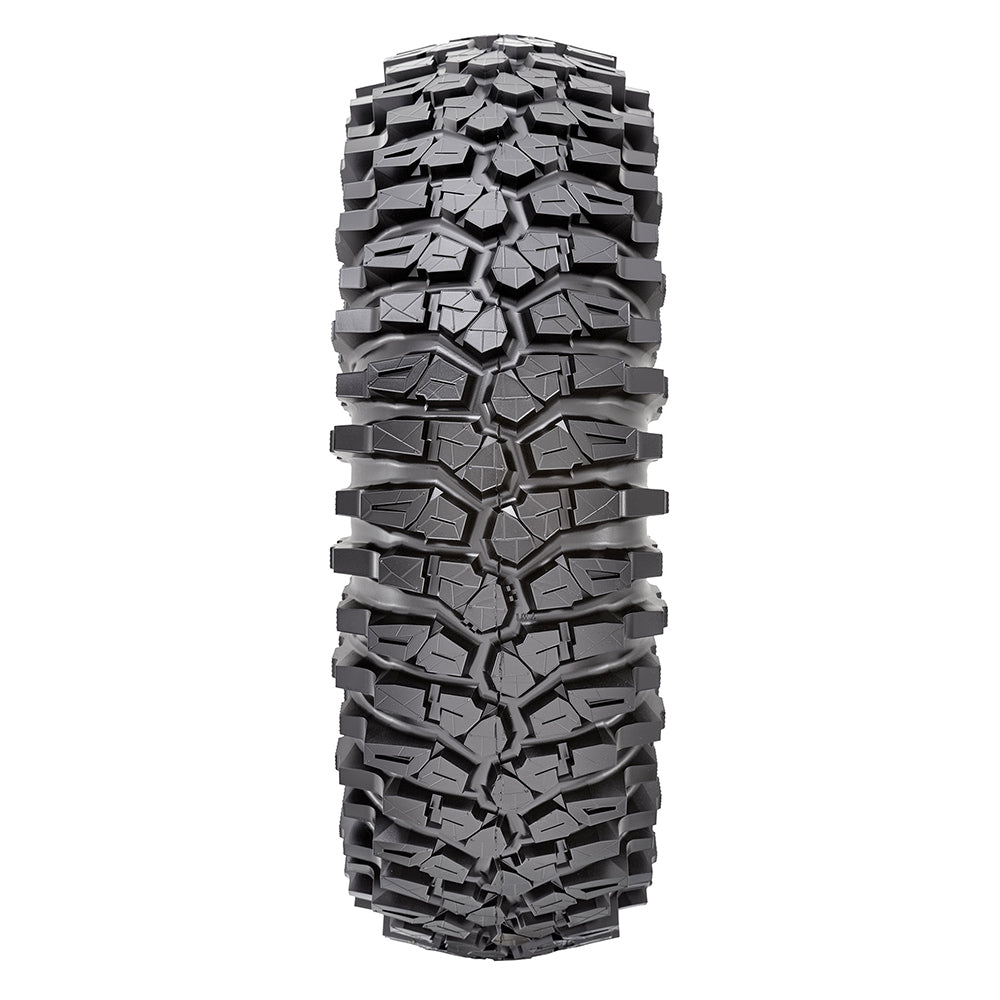 Detailed view of the aggressive rock crawling tread pattern and tread block lug design of the 8-ply standard and competition sticky Maxxis Roxxzilla UTV and SXS radial tire, featuring alternating staggered shoulder lugs for rock traction.