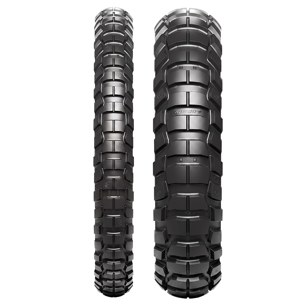 Full tread pattern view of both the front and rear Metzeler Karoo 4 ADV and Moto tires, featuring the patented multi-pitch knob lug design, transversal layout, and Dymatec Mould Angle Technology for optimized tread wear resistance.