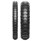 Full tread pattern view of both the front and rear Metzeler Karoo 4 ADV and Moto tires, featuring the patented multi-pitch knob lug design, transversal layout, and Dymatec Mould Angle Technology for optimized tread wear resistance.