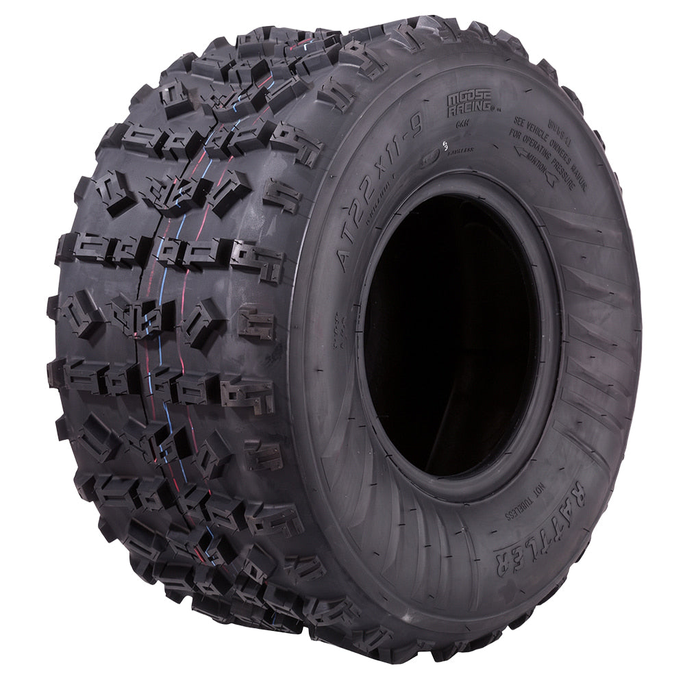 Angled view of the Moose Racing Rattler ATV rear tire, featuring a high-traction soft rubber compound construction and directional tread pattern, excelling in intermediate and hardpack competition, offered with fast and free shipping.