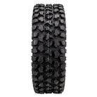 Full tread pattern design and lug detail view on the Odyssey Blaster utv and side-by-side tire, displaying multi-angled tread blocks and stepped tread block base design, as well as the snake head center tread block, and textured inter-tread casing to promote self-cleanout and reduce caked mud and dirt.