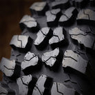 Close up detailed high definition view of the tread block design, inter-lug casing texture for cleanout, of the new Odyssey Force Conqueror 8-ply nylon radial aggressive all-terrain UTV and SXS tire, available in a wide variety of sizes.