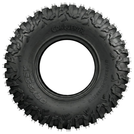 Full sidewall view of the Odyssey Conqueror UT32x10.00R15 UTV and SXS tire, showcasing the attractive Conqueror logo and wrap-around widely-spaced shoulder lugs for protection from rocks and punctures, while also promoting side traction for rocks and ruts.