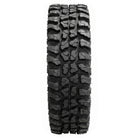 Full tread pattern design and lug detail view on the Odyssey Conqueror utv and side-by-side tire, displaying assymetrical tread blocks and aggressively spaced shoulder lug design, ensuring great cleanout and good mud and loose soil traction.