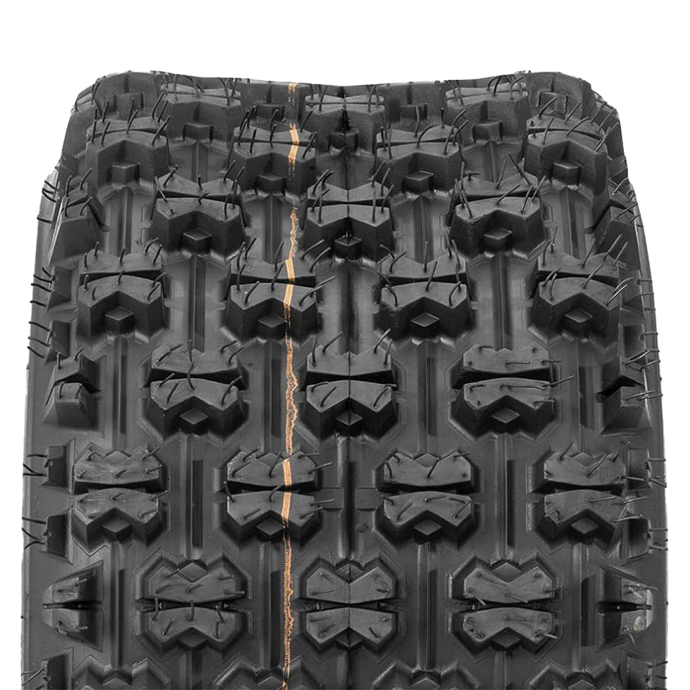 Close up detailed view of the bow-tie tread block design and ribbed between-block casing to promote mud clean out of the all-terrain QBT739 Quad and ATV tire, made with 4-ply bias construction.