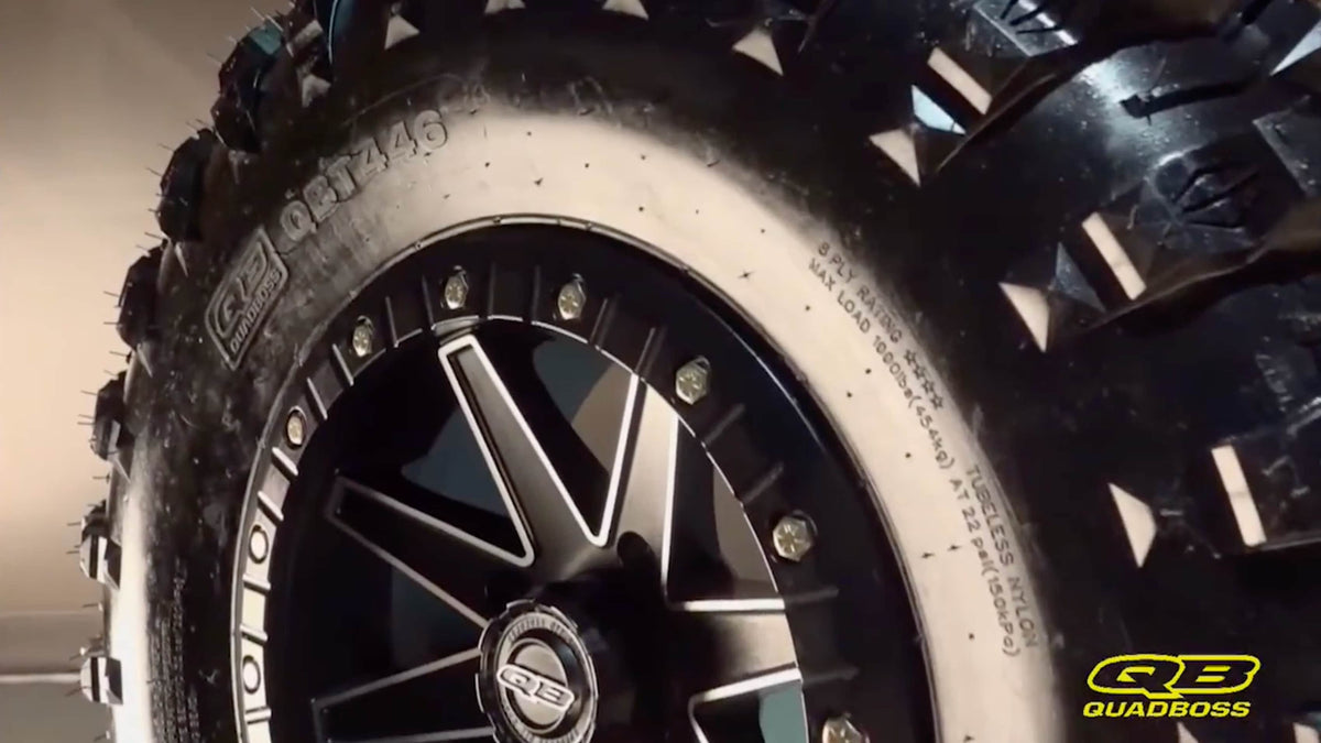 Load video: Close up of a QuadBoss Tire with QuadBoss Logo