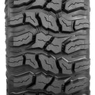 Focused, highly detailed close up view of the tread pattern and lug block design found on the Sedona Coyote ATV tire, showcasing the multi-angled block design, functional and effective siping on all lugs, tread wear bars, and inter-lug casing stone ejectors, designed to ensure top performance for many miles.