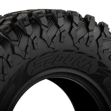 Close up detailed view of the wrap-around shoulder lug and sidewall design of the Sedona Ridge RIPR UTV tire, including a great view of the Sedona logo molded into the tire's sidewall.