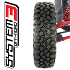View of the System 3 XC450 10-ply Radial UTV and Side-by-Side tire mounted on a machine with the System 3 logo beside the tire.