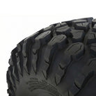 Close up, detailed view of the shoulder block tread pattern found on the System 3 XC450 UTV tire, featuring multi-angle tread blocks, siping, and wider spaced stepped shoulder lugs for off road and rock traction.