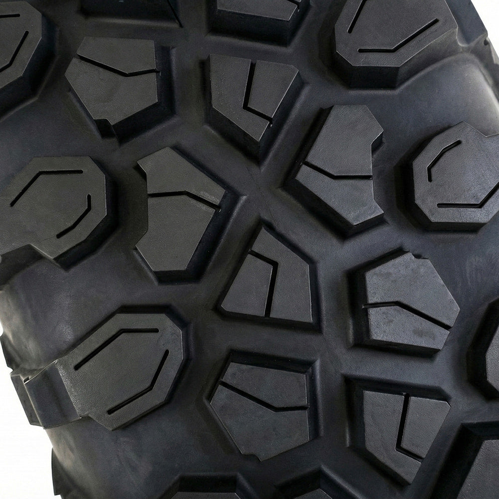 Close up, detailed view of the tread pattern found on the System 3 XC450 UTV tire, showcasing multi-angle tread blocks, siping, and compact center tread pattern for on-road performance, including wider spaced stepped shoulder lugs for off road and rock traction.