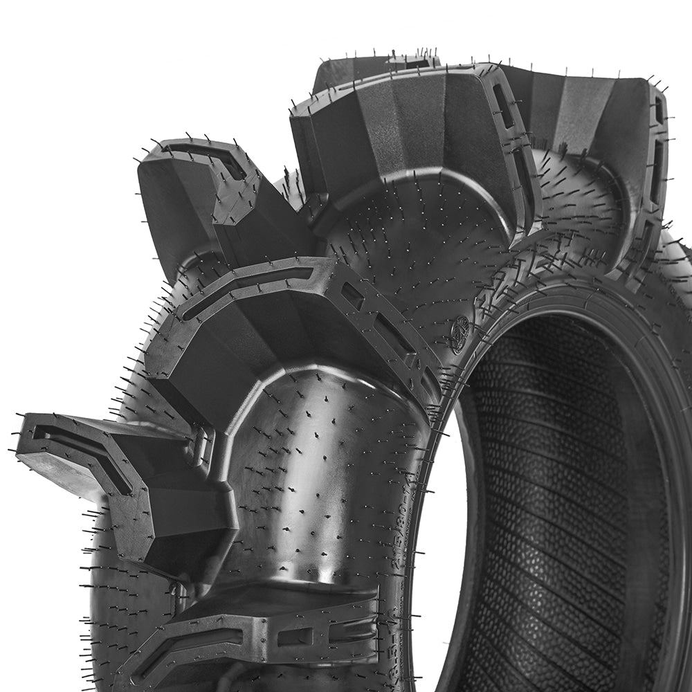 Close up, detailed view of the high quality construction and extra deep lug design of the Aztex XX UTV and ATV mud tire, designed with scoop style paddles, 20 per tire, designed with lightweight durable engineering technology and clamshell mold construction.