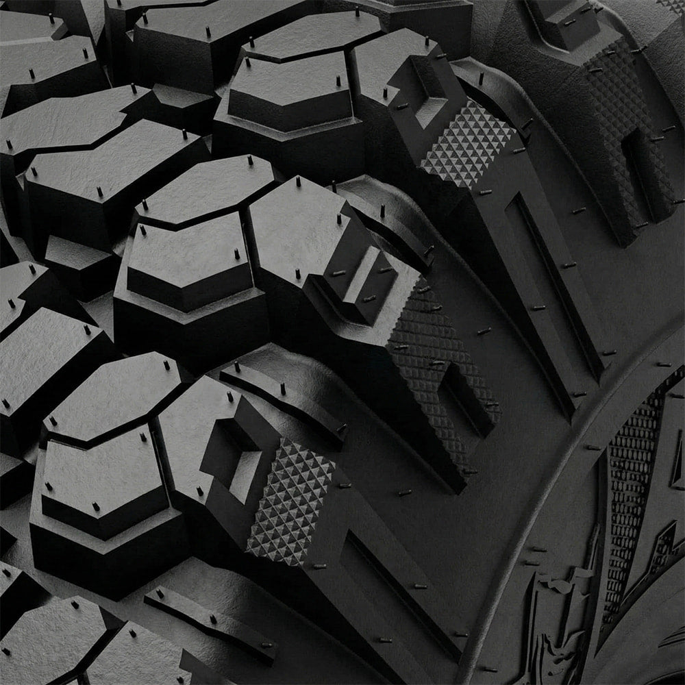 Close up detailed view of the tread block pattern and shoulder lug design of the Valor Alpha tire, showcasing the staggered and stepped lug design with tread void texture to promote mud and debris cleanout.