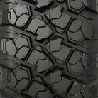 Close up detailed full tread pattern view of the Valor Alpha line of UTV and SXS 8-ply Radial A/T tires, featuring high traction bold lugs with stepped tread block design, siping, and multi-angled surface biting edges.