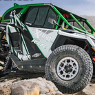 Xcomp A/T ATR tires mounted on Polaris RZR on the trail rock climbing.