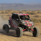 Jake Versey racing his SxS through the desert on his Gladiator Xcomp race 10-ply tires.